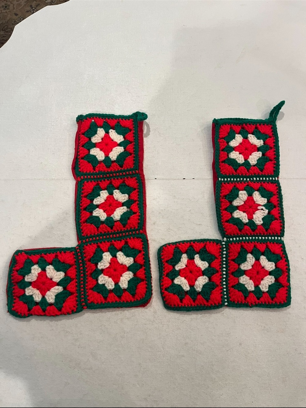 Vintage handmade granny square red & green Christmas stocking set. Set of 2.